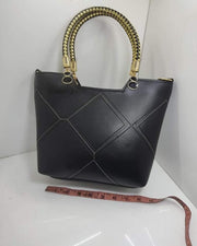 Leather X pattern handbag